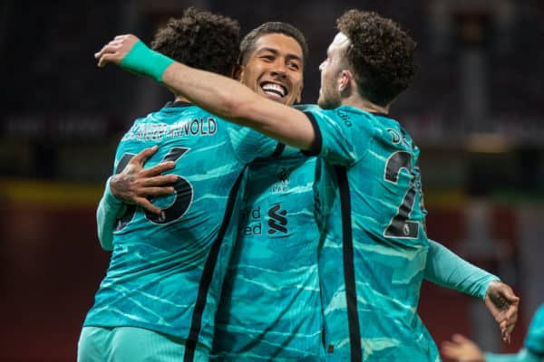 MANCHESTER, ENGLAND - Thursday, May 13, 2021: Liverpool's Roberto Firmino (C) celebrates with team-mates Mohamed Salah (L) and Diogo Jota (R) after scoring the third goal, his second of the game, during the FA Premier League match between Manchester United FC and Liverpool FC at Old Trafford. (Pic by David Rawcliffe/Propaganda)