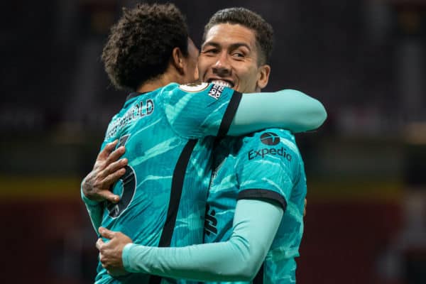 MANCHESTER, ENGLAND - Thursday, May 13, 2021: Liverpool's Roberto Firmino (R) celebrates with team-mate Mohamed Salah after scoring the third goal, his second of the game, during the FA Premier League match between Manchester United FC and Liverpool FC at Old Trafford. (Pic by David Rawcliffe/Propaganda)