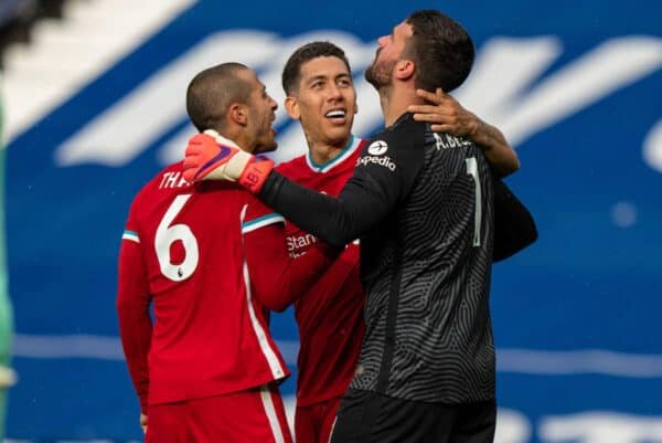 WEST BROMWICH, ENGLAND - Sunday, May 16, 2021: Liverpool's goalkeeper Alisson Becker (R) celebrates with team-mates Thiago Alcantara (L) and Roberto Firmino (C) after he scored the winning second goal with a head in injury time during the FA Premier League match between West Bromwich Albion FC and Liverpool FC at The Hawthorns. (Pic by David Rawcliffe/Propaganda)