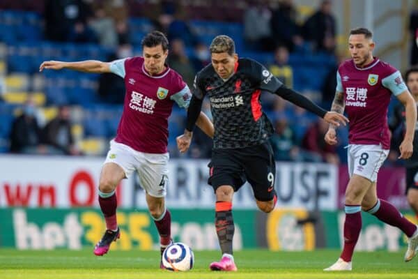 BURNLEY, ENGLAND - Wednesday, May 19, 2021: Liverpool's Roberto Firmino (R) is challenged by Burnley's Jack Cork (L) during the FA Premier League match between Burnley FC and Liverpool FC at Turf Moor. (Pic by David Rawcliffe/Propaganda)