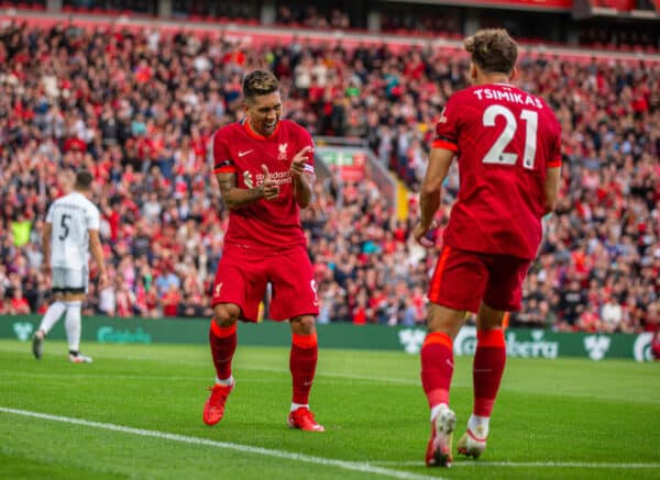 LIVERPOOL, ENGLAND - Monday, August 9, 2021: Liverpool's Roberto Firmino (L) celebrates with team-mate Kostas Tsimikas  after scoring the second goal during a pre-season friendly match between Liverpool FC and Club Atlético Osasuna at Anfield. (Pic by David Rawcliffe/Propaganda)