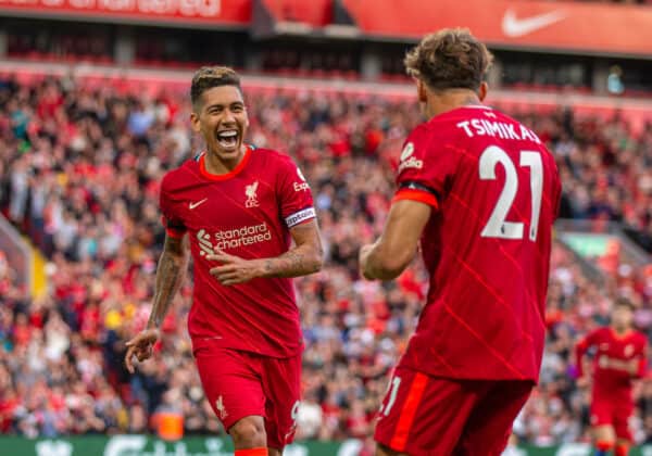 LIVERPOOL, ENGLAND - Monday, August 9, 2021: Liverpool's Roberto Firmino (L) celebrates with team-mate Kostas Tsimikas after scoring the second goal during a pre-season friendly match between Liverpool FC and Club Atlético Osasuna at Anfield. (Pic by David Rawcliffe/Propaganda)