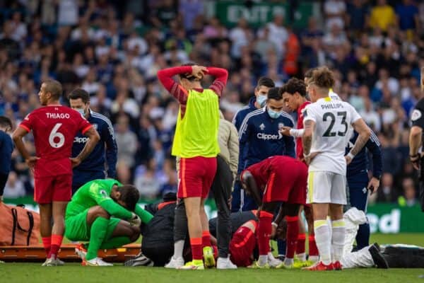 LEEDS, ENGLAND - Sunday, September 12, 2021: Liverpool's players look on as Harvey Elliott receives treatment for an injury before being carried off during the FA Premier League match between Leeds United FC and Liverpool FC at Elland Road. (Pic by David Rawcliffe/Propaganda)