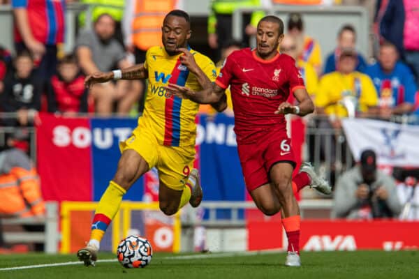 LIVERPOOL, ENGLAND - Saturday, September 18, 2021: Crystal Palace's Jordan Ayew (L) and Liverpool's Thiago Alcantara during the FA Premier League match between Liverpool FC and Crystal Palace FC at Anfield. (Pic by David Rawcliffe/Propaganda)