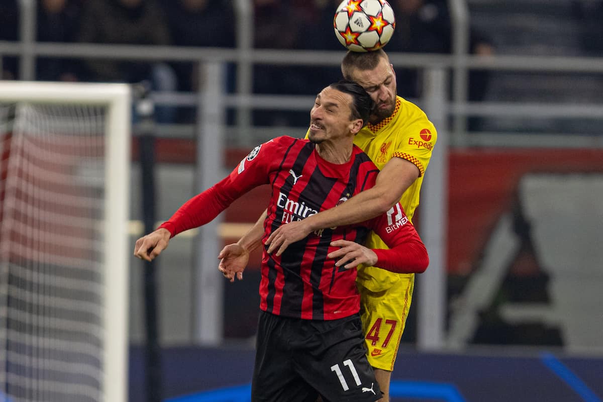 MILAN, ITALY - Tuesday, December 7, 2021: Liverpool's Nathaniel Phillips (R) challenges for a header with AC Milan's Zlatan Ibrahimovic? during the UEFA Champions League Group B Matchday 6 game between AC Milan and Liverpool FC at the Stadio San Siro. (Pic by David Rawcliffe/Propaganda)