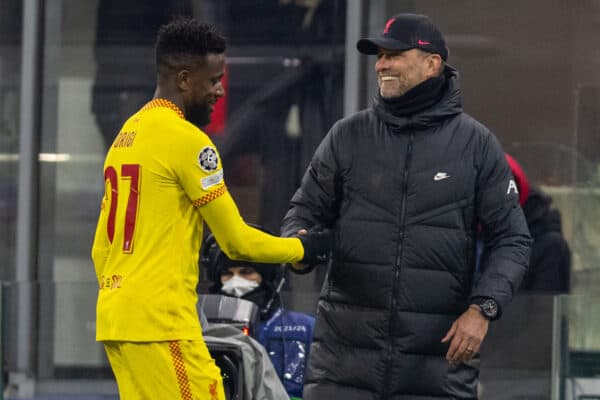 MILAN, ITALY - Tuesday, December 7, 2021: Liverpool's manager Jürgen Klopp shakes hands with match-winning goal-scorer Divock Origi during the UEFA Champions League Group B Matchday 6 game between AC Milan and Liverpool FC at the Stadio San Siro. Liverpool won 2-1 and top the group with six wins from six games. (Pic by David Rawcliffe/Propaganda)