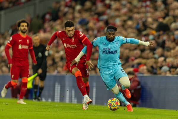 LIVERPOOL, ENGLAND - Thursday, December 16, 2021: Liverpool's Alex Oxlade-Chamberlain (L) and Newcastle United's Allan Saint-Maximin during the FA Premier League match between Liverpool FC and Newcastle United FC at Anfield. (Pic by David Rawcliffe/Propaganda)