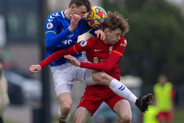 LIVERPOOL, ENGLAND - Saturday, January 15, 2022: Liverpool's Conor Bradlev (R) challenges for a header with Everton's Joe Anderson during the Premier League 2 Division 1 match between Liverpool FC Under-23's and Everton FC Under-23's, the Mini-Merseyside Derby, at the Liverpool Academy. (Pic by David Rawcliffe/Propaganda)