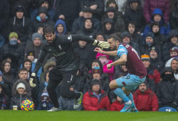 BURNLEY, ENGLAND - Sunday, February 13, 2022: Liverpool's goalkeeper Alisson Becker (L) and Burnley's Jay Rodriguez during the FA Premier League match between Burnley FC and Liverpool FC at Turf Moor. (Pic by David Rawcliffe/Propaganda)