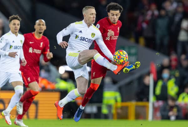 LIVERPOOL, ENGLAND - Wednesday, February 23, 2022: Liverpool's Curtis Jones (R) challenges Leeds United's Adam Forshaw during the FA Premier League match between Liverpool FC and Leeds United FC at Anfield. (Pic by David Rawcliffe/Propaganda)