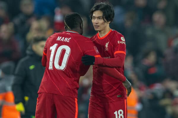 LIVERPOOL, ENGLAND - Wednesday, March 2, 2022: Liverpool's two-goal hero Takumi Minamino embraces Sadio Mané after the FA Cup 5th Round match between Liverpool FC and Norwich City FC at Anfield. Liverpool won 2-1. (Pic by David Rawcliffe/Propaganda)