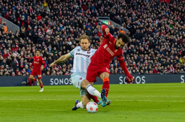 LIVERPOOL, ENGLAND - Friday, March 4, 2022: Liverpool's Mohamed Salah is tackled by West Ham United's Craig Dawson but no penalty was awarded during the FA Premier League match between Liverpool FC and West Ham United FC at Anfield. (Pic by David Rawcliffe/Propaganda)