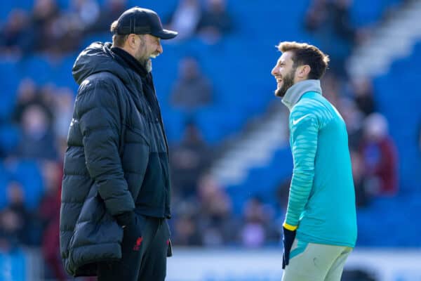 BRIGHTON AND HOVE, ENGLAND - Saturday, March 12, 2022: Liverpool's manager Jürgen Klopp (L) chats with former player Brighton & Hove Albion's Adam Lallana during the pre-match warm-up before the FA Premier League match between Brighton & Hove Albion FC and Liverpool FC at the AMEX Community Stadium. (Pic by David Rawcliffe/Propaganda)