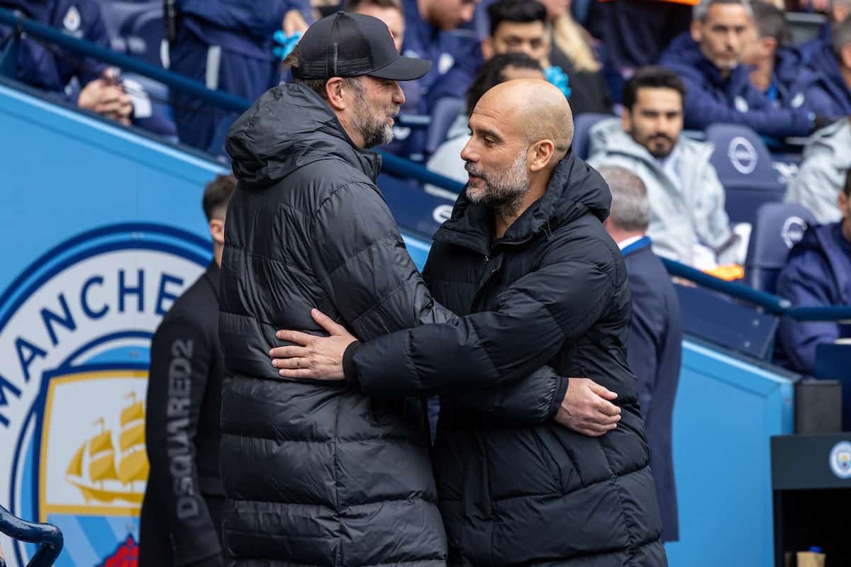 MANCHESTER, ENGLAND - Sunday, April 10, 2022: Manchester City's manager Josep 'Pep' Guardiola (R) embraces Liverpool's manager Jürgen Klopp before the FA Premier League match between Manchester City FC and Liverpool FC at the City of Manchester Stadium. (Pic by David Rawcliffe/Propaganda)