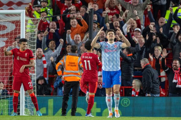 LIVERPOOL, ENGLAND - Tuesday, April 19, 2022: Manchester United's captain Harry Maguire (R) looks dejected as Liverpool's Mohamed Salah (C) celebrates after scoring the second goal during the FA Premier League match between Liverpool FC and Manchester United FC at Anfield. (Pic by David Rawcliffe/Propaganda)