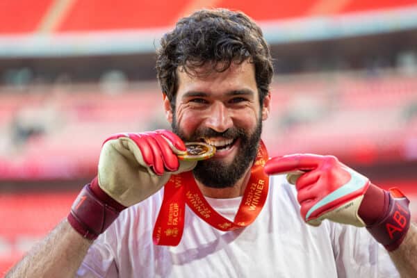 LONDON, ENGLAND - Saturday, May 14, 2022: Liverpool's goalkeeper Alisson Becker celebrates by biting his winners' medal after the FA Cup Final between Chelsea FC and Liverpool FC at Wembley Stadium. The game ended in a goal-less draw, Liverpool won 6-5 on penalties. (Pic by David Rawcliffe/Propaganda)