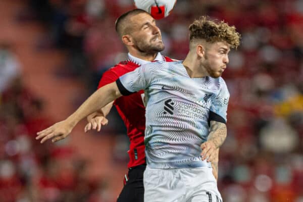 BANGKOK, THAILAND - Tuesday, July 12, 2022: Liverpool's Harvey Elliott (R) challenges for a header with Manchester United's Luke Shaw during the Bangkok Century Cup pre-season friendly match between Liverpool FC and Manchester United FC at the Rajamangala National Stadium. (Pic by David Rawcliffe/Propaganda)