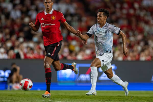 BANGKOK, THAILAND - Tuesday, July 12, 2022: Liverpool's Fabio Carvalho (R) and Manchester United's Raphaël Varane during the Bangkok Century Cup pre-season friendly match between Liverpool FC and Manchester United FC at the Rajamangala National Stadium. (Pic by David Rawcliffe/Propaganda)