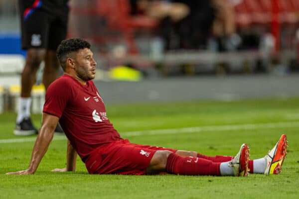 SINGAPORE - Friday, July 15, 2022: Liverpool's Alex Oxlade-Chamberlain goes down with an injury during the Standard Chartered Trophy pre-season friendly match between Liverpool FC and Crystal Palace FC at the Singapore National Stadium. (Pic by David Rawcliffe/Propaganda)