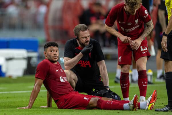 SINGAPORE - Friday, July 15, 2022: Liverpool's Alex Oxlade-Chamberlain goes down injured during the Standard Chartered Trophy pre-season friendly match between Liverpool FC and Crystal Palace FC at the Singapore National Stadium. (Pic by David Rawcliffe/Propaganda)