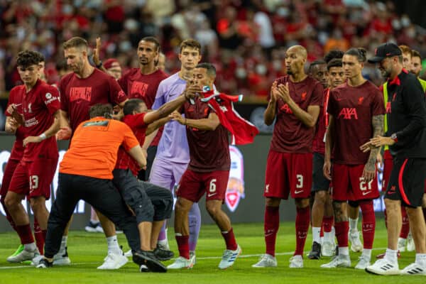 SINGAPORE - Friday, July 15, 2022: A supporter is tackled to the ground by security as he attempts to embrace Liverpool's Thiago Alcântara during the Standard Chartered Trophy pre-season friendly match between Liverpool FC and Crystal Palace FC at the Singapore National Stadium. (Pic by David Rawcliffe/Propaganda)