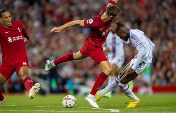 LIVERPOOL, ENGLAND - Monday, August 15, 2022: Crystal Palace's Wilfried Zaha (R) takes on Liverpool's Nathaniel Phillips during the FA Premier League match between Liverpool FC and Crystal Palace FC at Anfield. (Pic by David Rawcliffe/Propaganda)