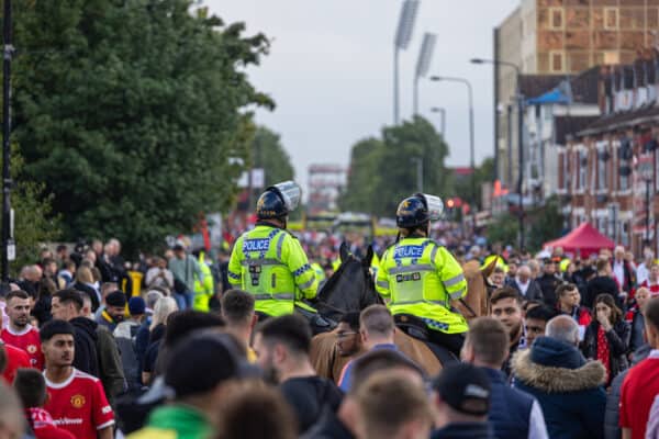 MANCHESTER, ENGLAND - Monday, August 22, 2022: Mounted police walk between the supporters arriving before the FA Premier League match between Manchester United FC and Liverpool FC at Old Trafford. (Pic by David Rawcliffe/Propaganda)