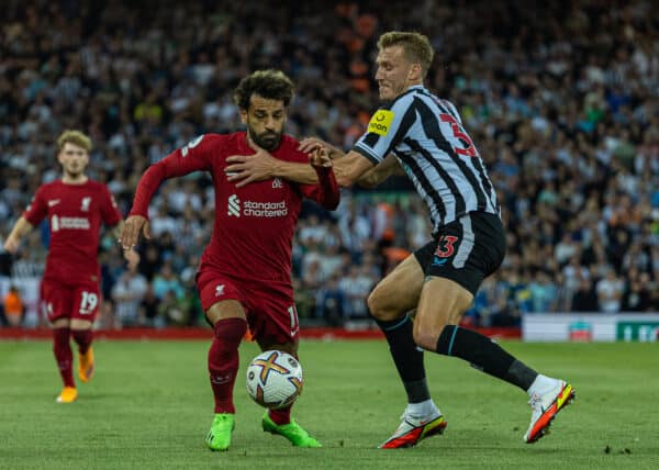 LIVERPOOL, ENGLAND - Wednesday, August 31, 2022: Liverpool's Mohamed Salah (L) is challenged by Newcastle United's Matt Targett during the FA Premier League match between Liverpool FC and Newcastle United FC at Anfield. (Pic by David Rawcliffe/Propaganda)