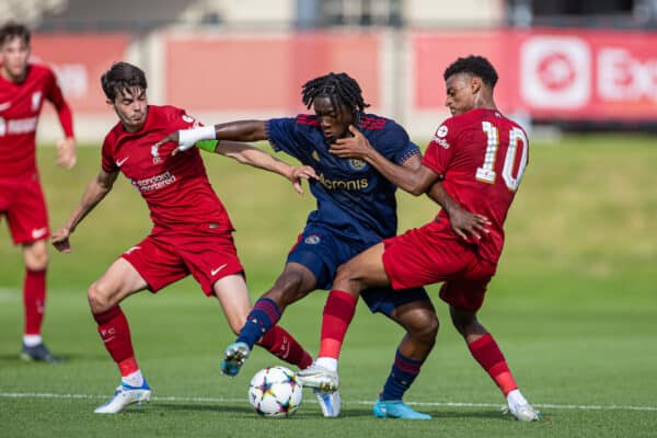 LIVERPOOL, ENGLAND - Tuesday, September 13, 2022: Liverpool's captain Dominic Corness (L) and Melkamu Frauendorf (R) challenge AFC Ajax's Rafael Sarfo during the UEFA Youth League Group A Matchday 2 game between Liverpool FC Under-19's and AFC Ajax Under-19's at the Liverpool Academy. (Pic by David Rawcliffe/Propaganda)