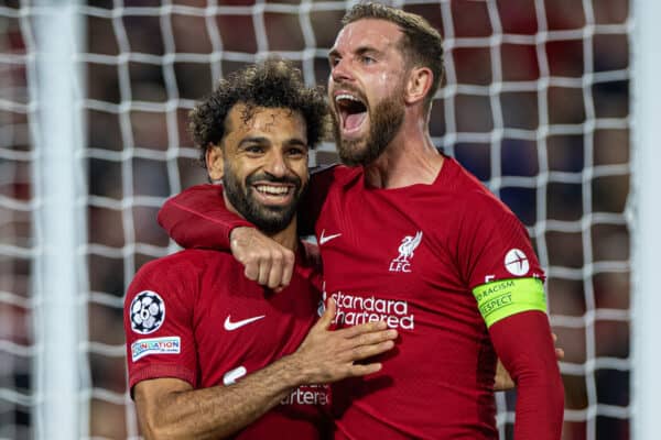 LIVERPOOL, ENGLAND - Tuesday, October 3, 2022: Liverpool's Mohamed Salah (L) celebrates with team-mate captain Jordan Henderson after scoring the second goal, from a penalty kick, during the UEFA Champions League Group A matchday 3 game between Liverpool FC and Glasgow Rangers FC at Anfield. (Pic by David Rawcliffe/Propaganda)