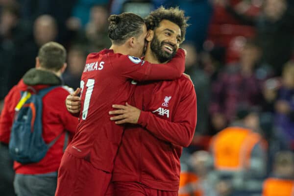 LIVERPOOL, ENGLAND - Sunday, October 16, 2022: Liverpool's match-winning goal-scorer Mohamed Salah (R) celebrates with Kostas Tsimikas after the FA Premier League match between Liverpool FC and Manchester City FC at Anfield. (Pic by David Rawcliffe/Propaganda)