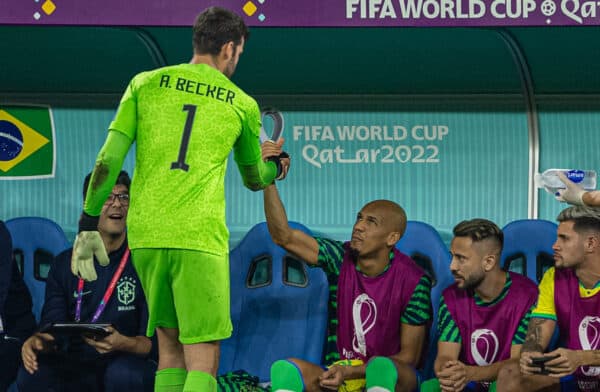 DOHA, QATAR - Monday, December 5, 2022: Brazil's goalkeeper Alisson Becker (L) shakes hands with Liverpool team-mate Fábio Henrique Tavares 'Fabinho' after he was substituted during the FIFA World Cup Qatar 2022 Round of 16 match between Brazil and South Korea at the Stadium 974. (Pic by David Rawcliffe/Propaganda)