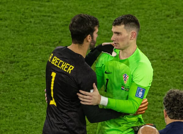 DOHA, QATAR - Friday, December 9, 2022: Brazil's goalkeeper Alisson Becker and Croatia's goalkeeper Dominik Livakovic embrace after the penalty shoot-out the FIFA World Cup Qatar 2022 Quarter-Final match between Croatia and Brazil at the Education City Stadium. (Pic by David Rawcliffe/Propaganda)