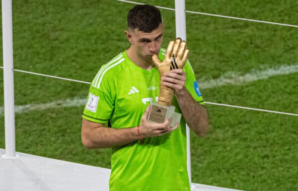 DOHA, QATAR - Sunday, December 18, 2022: Argentina's goalkeeper Emiliano Martínez kisses the thumb of the Golden Glove Award during the FIFA World Cup Qatar 2022 Final match between Argentina and France at the Lusail Stadium. The game ended in a 3-3 draw, Argentina won 4-2 on penalties. (Pic by David Rawcliffe/Propaganda)