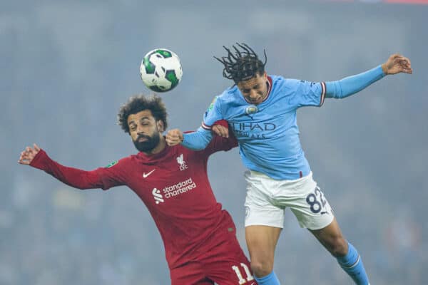 MANCHESTER, ENGLAND - Thursday, December 22, 2022: Liverpool's Mohamed Salah (L) challenges for a header with Manchester City's Rico Mark Lewis during the Football League Cup 4th Round match between Manchester City FC and Liverpool FC at the City of Manchester Stadium. (Pic by David Rawcliffe/Propaganda)