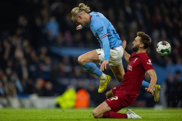 MANCHESTER, ENGLAND - Thursday, December 22, 2022: Manchester City's Erling Haaland (L) can't get past Liverpool's Nathaniel Phillips during the Football League Cup 4th Round match between Manchester City FC and Liverpool FC at the City of Manchester Stadium. (Pic by David Rawcliffe/Propaganda)