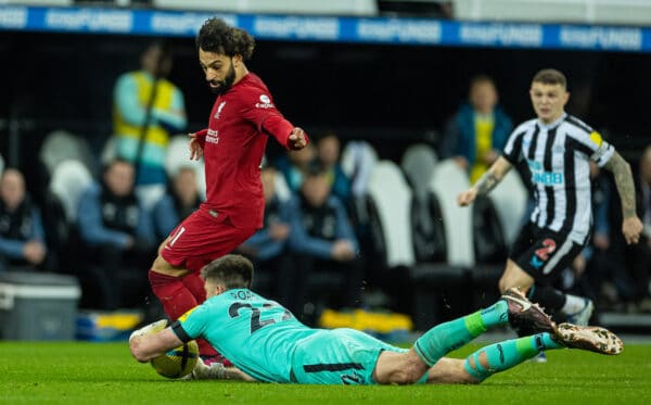 NEWCASTLE-UPON-TYNE, ENGLAND - Saturday, February 18, 2023: Newcastle United's goalkeeper Nick Pope handles the ball outside the box under pressure from Liverpool's Mohamed Salah and is subsequently sent off during the FA Premier League match between Newcastle United FC and Liverpool FC at St. James' Park. (Pic by David Rawcliffe/Propaganda)