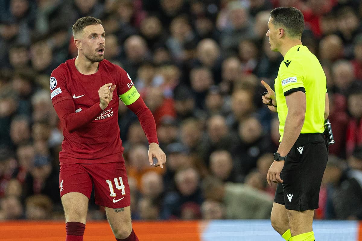 LIVERPOOL, ENGLAND - Tuesday, February 21, 2023: Liverpool's captain Jordan Henderson (L) speaks to the referee István Kovács during the UEFA Champions League Round of 16 1st Leg game between Liverpool FC and Real Madrid at Anfield. (Pic by David Rawcliffe/Propaganda)