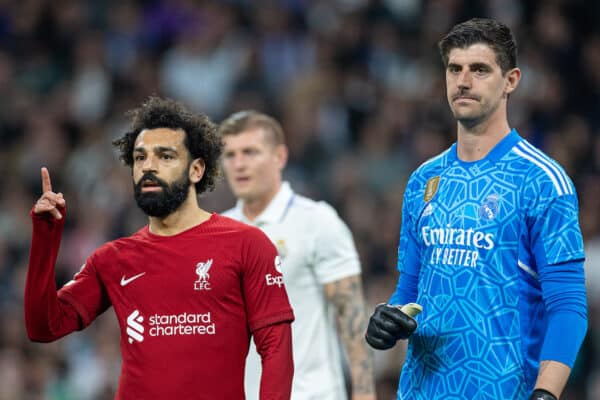 MADRID, SPAIN - Wednesday, March 15, 2023: Liverpool's Mohamed Salah (L) and Real Madrid's goalkeeper Thibaut Courtois during the UEFA Champions League Round of 16 2nd Leg game between Real Madrid CF and Liverpool FC at the Estadio Santiago Bernabéu. (Pic by David Rawcliffe/Propaganda)