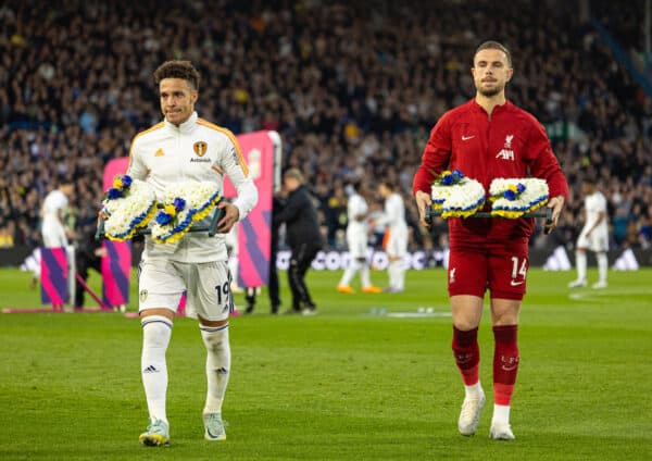 LEEDS, ENGLAND - Monday, April 17, 2023: Liverpool's captain Jordan Henderson (R) and Leeds United's Rodrigo Moreno Machado lay floral tributes in front of the travelling Liverpool supporters in memory of the 97 victims of the Hillsborough Stadium Disaster, two days after the 34th anniversary, before the FA Premier League match between Leeds United FC and Liverpool FC at Elland Road. (Pic by David Rawcliffe/Propaganda)