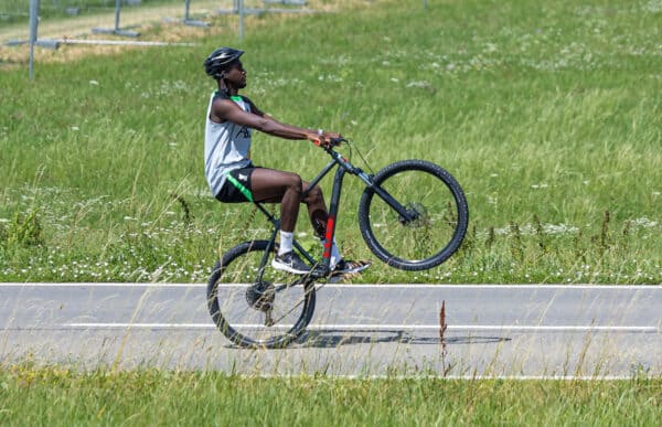 DONESCHINGEN, GERMANY - Monday, July 17, 2023: Liverpool's Ibrahima Konaté pulls a wheelie as he rides a bike back to the team hotel after a training session during the club's pre-season preparations in Germany. (Pic by David Rawcliffe/Propaganda)
