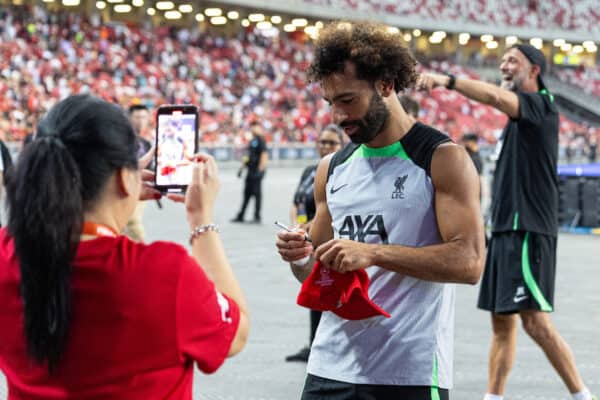 SINGAPORE - Saturday, July 29, 2023: Liverpool's Mohamed Salah signs autographs for supporters after a training session ahead of the pre-season friendly match between Liverpool FC and Leicester City FC at the Singapore National Stadium. (Pic by David Rawcliffe/Propaganda)
