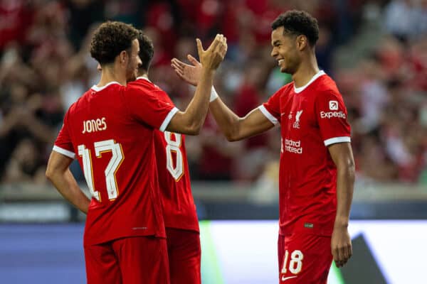 SINGAPORE - Wednesday, August 2, 2023: Liverpool's Cody Gakpo (R) celebrates with team-mate Curtis Jones after scoring the first goal during a pre-season friendly match between Liverpool FC and FC Bayern Munich FC at the Singapore National Stadium. (Pic by David Rawcliffe/Propaganda)