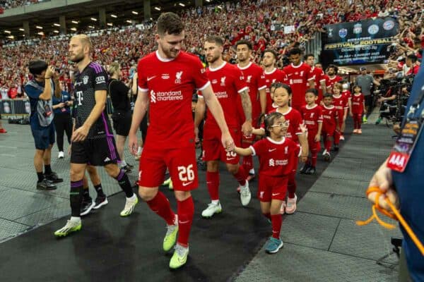 SINGAPORE - Wednesday, August 2, 2023: Liverpool's Andy Robertson walks out with mascots before a pre-season friendly match between Liverpool FC and FC Bayern Munich FC at the Singapore National Stadium. (Pic by David Rawcliffe/Propaganda)