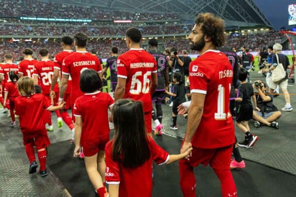 SINGAPORE - Wednesday, August 2, 2023: Liverpool's Mohamed Salah walks out with mascots before a pre-season friendly match between Liverpool FC and FC Bayern Munich FC at the Singapore National Stadium. (Pic by David Rawcliffe/Propaganda)