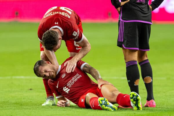 SINGAPORE - Wednesday, August 2, 2023: Liverpool's Alexis Mac Allister goes down injured during a pre-season friendly match between Liverpool FC and FC Bayern Munich FC at the Singapore National Stadium. (Pic by David Rawcliffe/Propaganda)