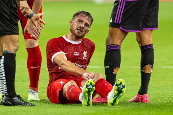 SINGAPORE - Wednesday, August 2, 2023: Liverpool's Alexis Mac Allister goes down injured during a pre-season friendly match between Liverpool FC and FC Bayern Munich FC at the Singapore National Stadium. (Pic by David Rawcliffe/Propaganda)