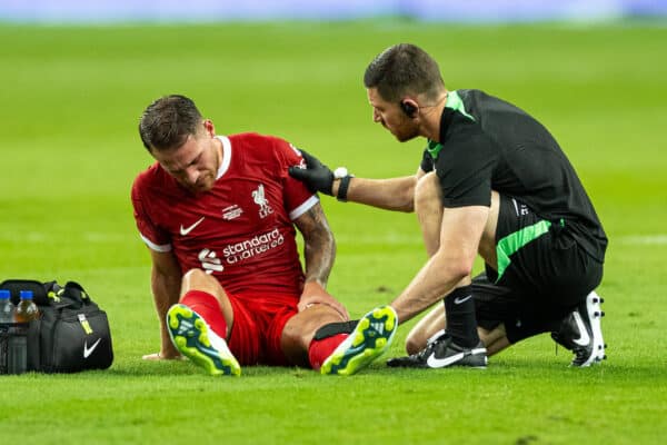 SINGAPORE - Wednesday, August 2, 2023: Liverpool's Alexis Mac Allister receives treatment for an injury during a pre-season friendly match between Liverpool FC and FC Bayern Munich FC at the Singapore National Stadium. (Pic by David Rawcliffe/Propaganda)
