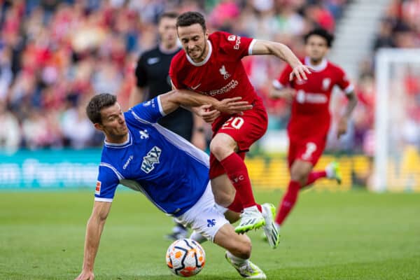 PRESTON, ENGLAND - Monday, August 7, 2023: Liverpool's Diogo Jota (R) is challenged by SV Darmstadt 98's Christoph Zimmermann during a pre-season friendly match between Liverpool FC and SV Darmstadt 98 at Deepdale. (Pic by David Rawcliffe/Propaganda)