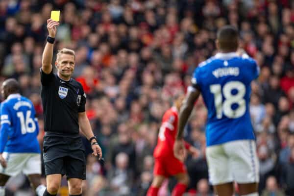 LIVERPOOL, ENGLAND - Saturday, October 21, 2023: Referee Craig Pawson shows a yellow card to Everton's Ashley Young during the FA Premier League match between Liverpool FC and Everton FC, the 243rd Merseyside Derby, at Anfield. (Photo by David Rawcliffe/Propaganda)